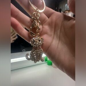 Gold and pink dog keychain.